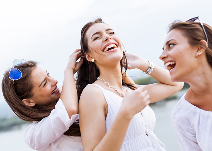 Three women having a great time and laughing