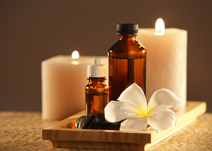 Essential oils and lit candles for sleep  and aromatherapy