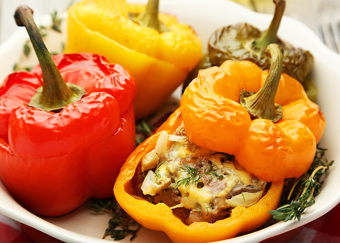 red-and-yellow-stuffed-peppers-in-a-white-bowl