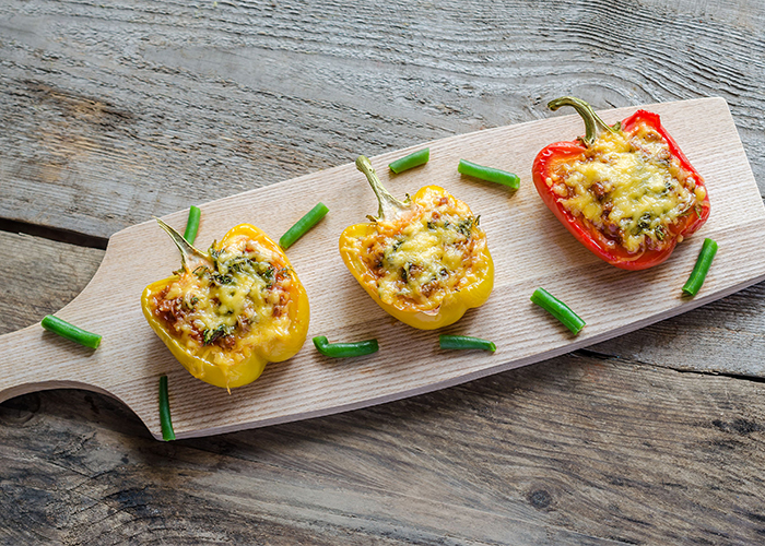 stuffed-peppers-with-meat-on-a-wooden-board