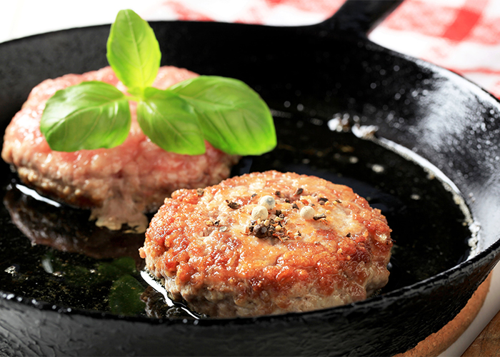 keto beef patties frying in pan